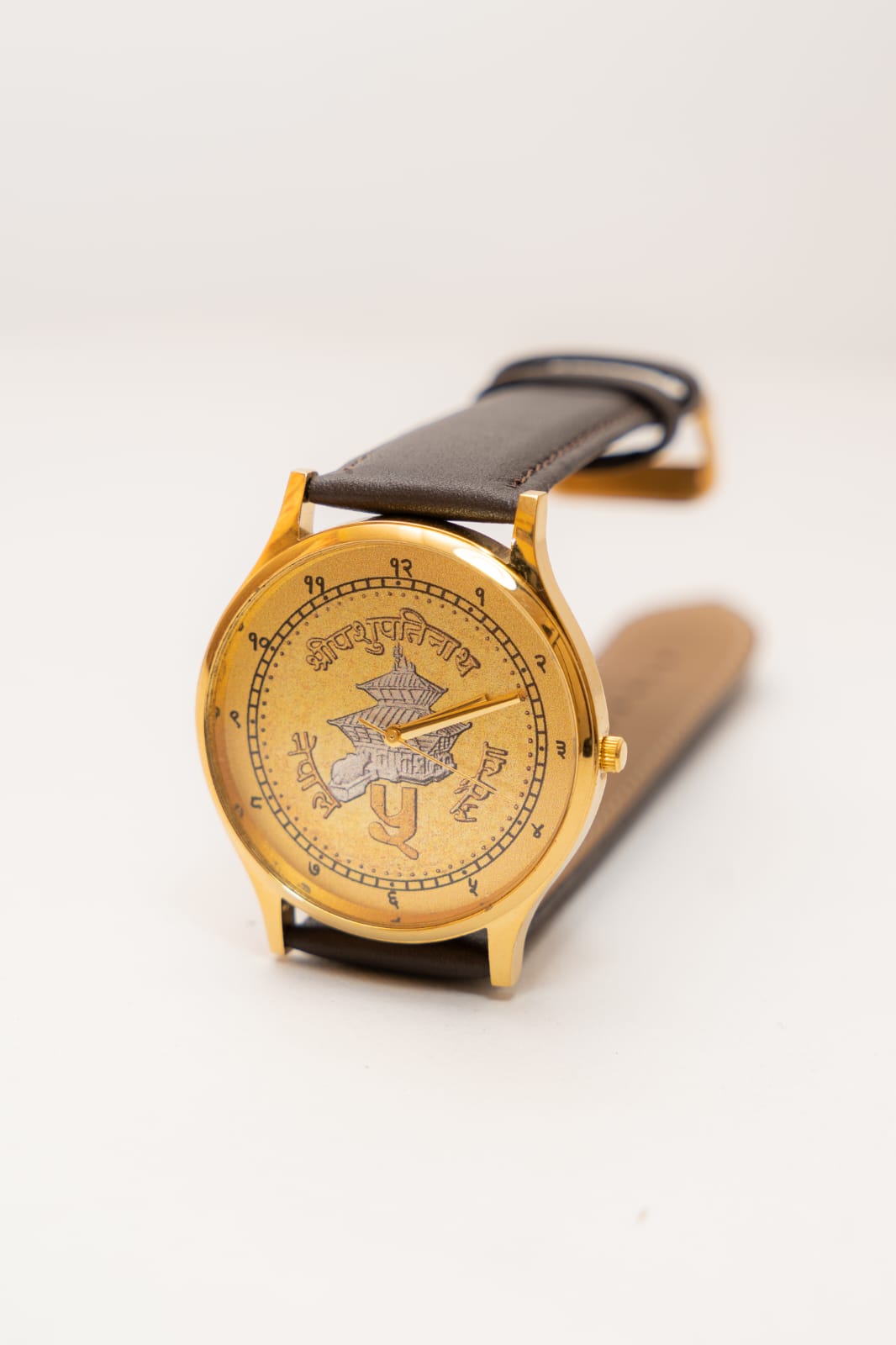 Prachin Nepal Version 1 watch with a gold Pashupatinath dial and leather strap
